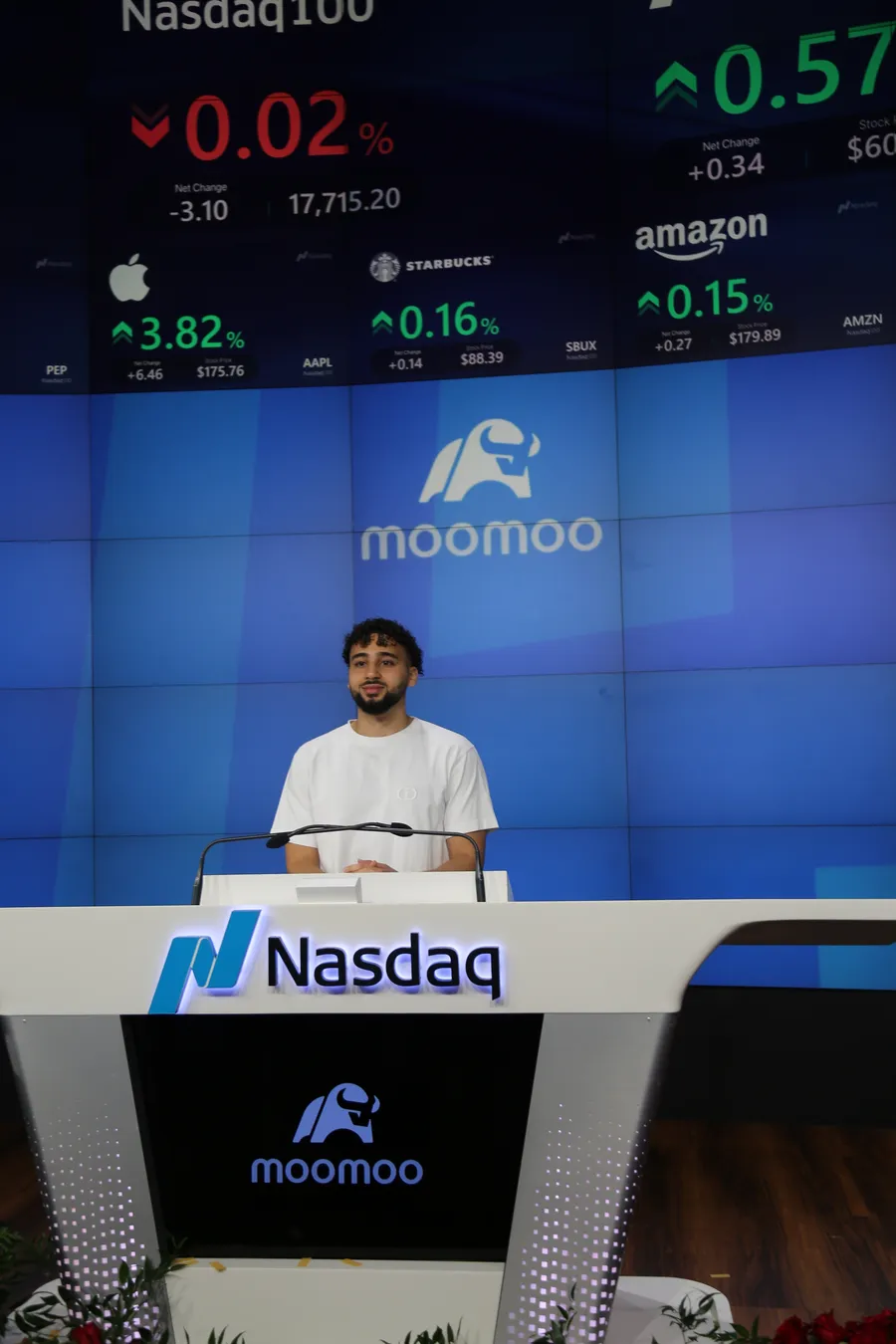 Nour speaking at the Nasdaq podium